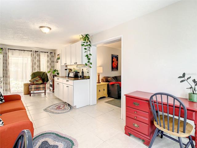 The family room boasts built-in cabinets and shelving that includes a lovely coffee bar/buffet