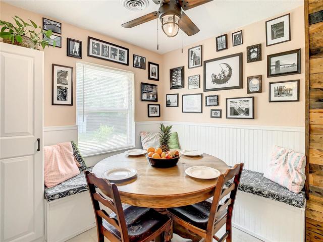 eat-in breakfast nook furnished with a long built-in bench that maximizes space and seating while providing storage space underneath.