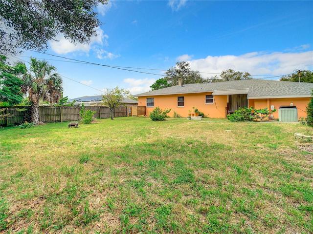 The Large Fully fenced-in back yard offers plenty of green space and a storage shed. Keep the dirt outside or wash dogs with the unique shower set up in the back yard too.