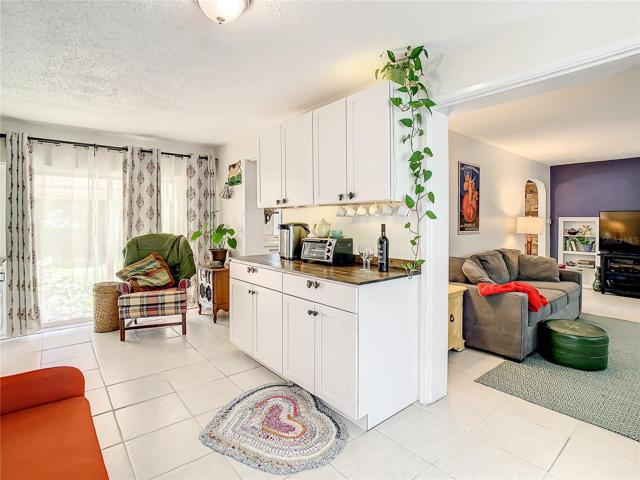 The family room boasts built-in cabinets and shelving that includes a lovely coffee bar/buffet