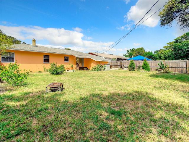 The Large Fully fenced-in back yard offers plenty of green space and a storage shed. Keep the dirt outside or wash dogs with the unique shower set up in the back yard too.