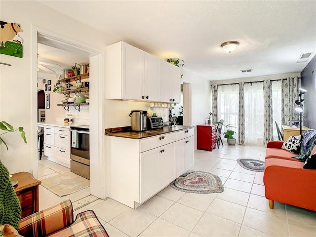 The family room boasts built-in cabinets and shelving that includes a lovely coffee bar/buffet