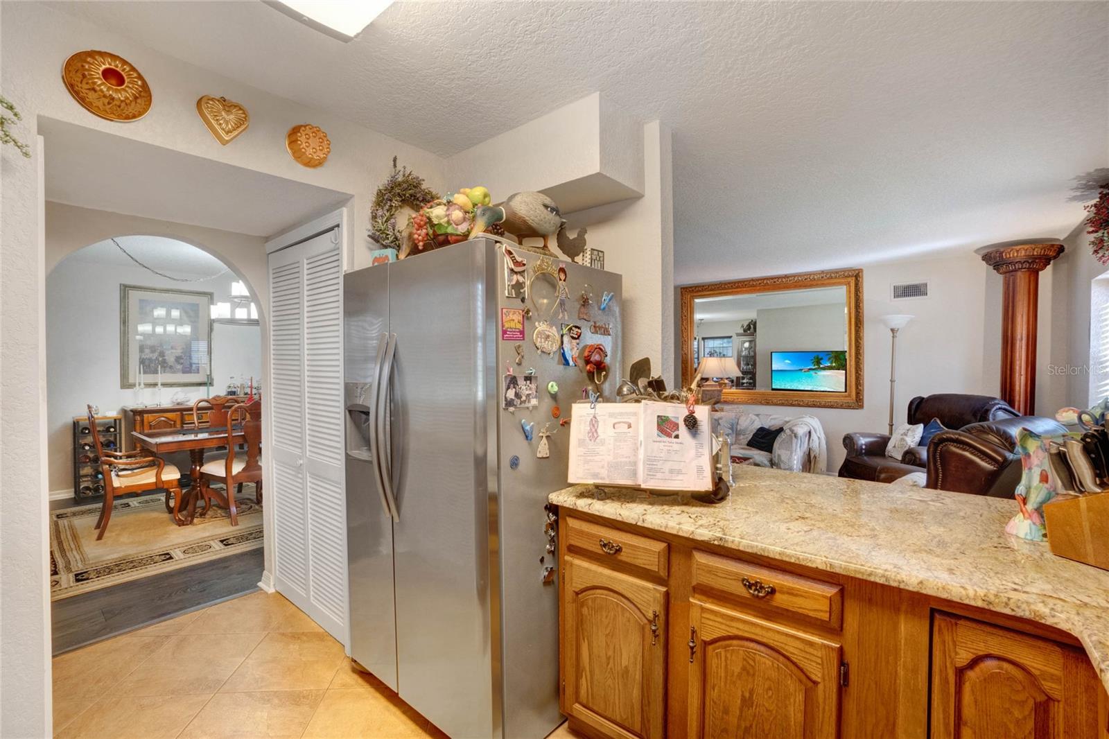 Kitchen looks into Living Room