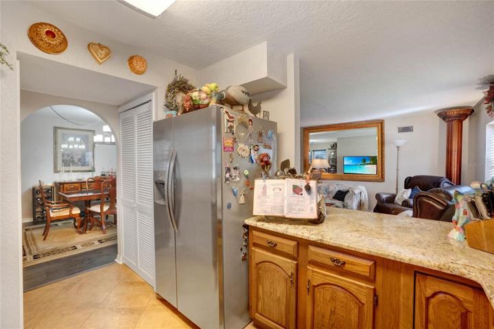Kitchen looks into Living Room