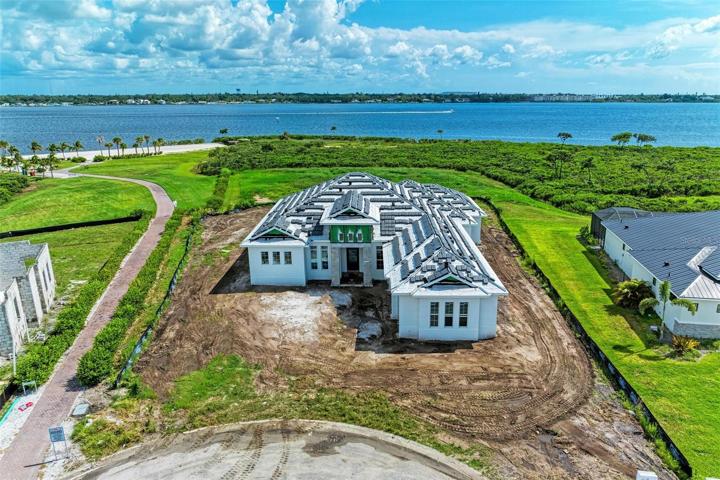 Drone photo of home with riverfront view