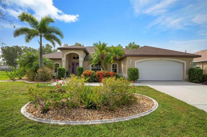 A front view of the home, beautifully landscaped.