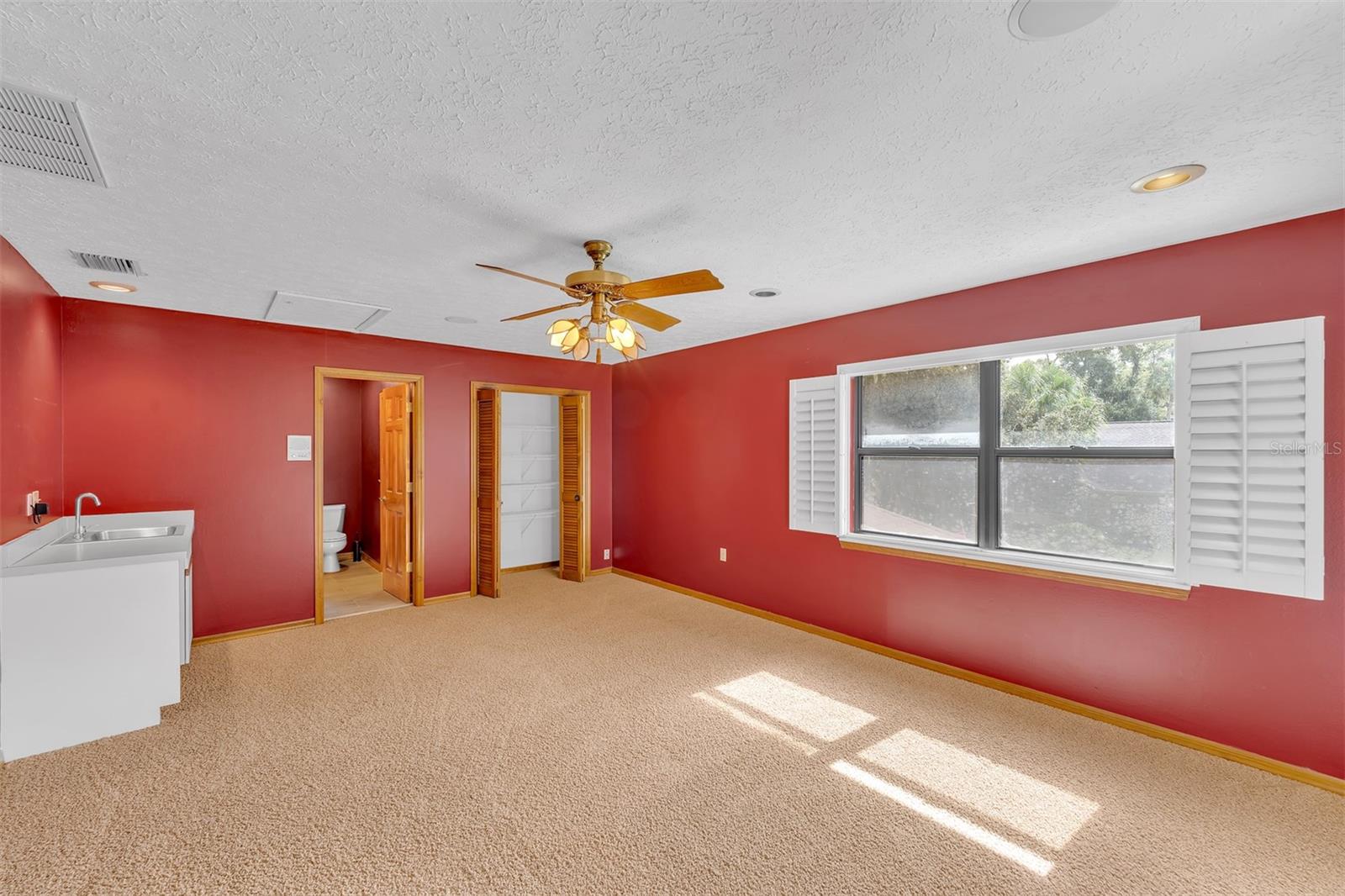 Bonus room/4th bedroom with access to the 3rd full bath and a private deck