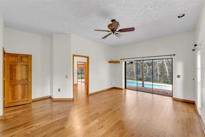 Master Bedroom has great views of the pool and yard along with private den access.
