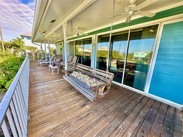 Another very large open-air patio located on the Gulf (West) side of the home.  Open your pocket sliders and watch the Sun set every night.  It never disappoints.