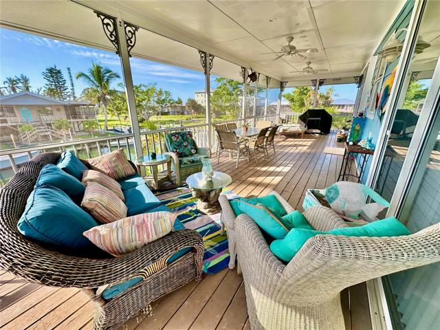 The multiple outdoor fans keep the air moving and everyone cool on this large open patio.