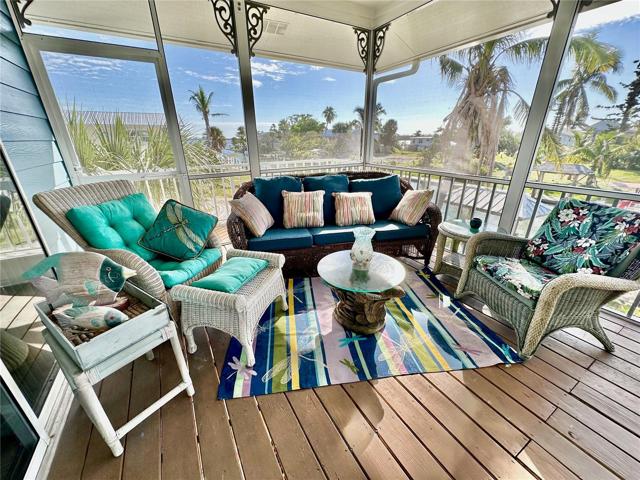 Plenty of room for everyone on this spacious screen-in front patio.
