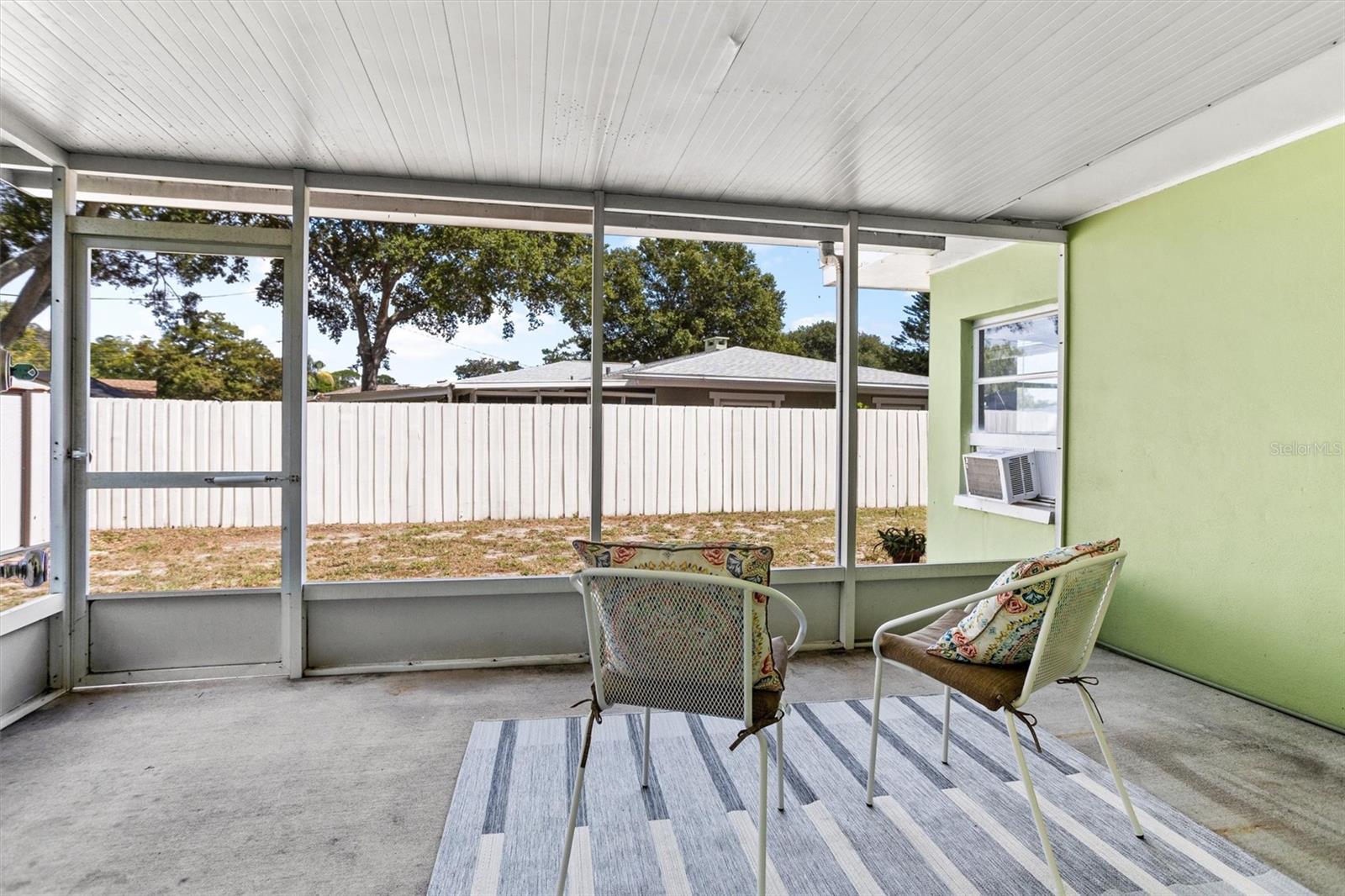 Screened in side porch off kitchen.