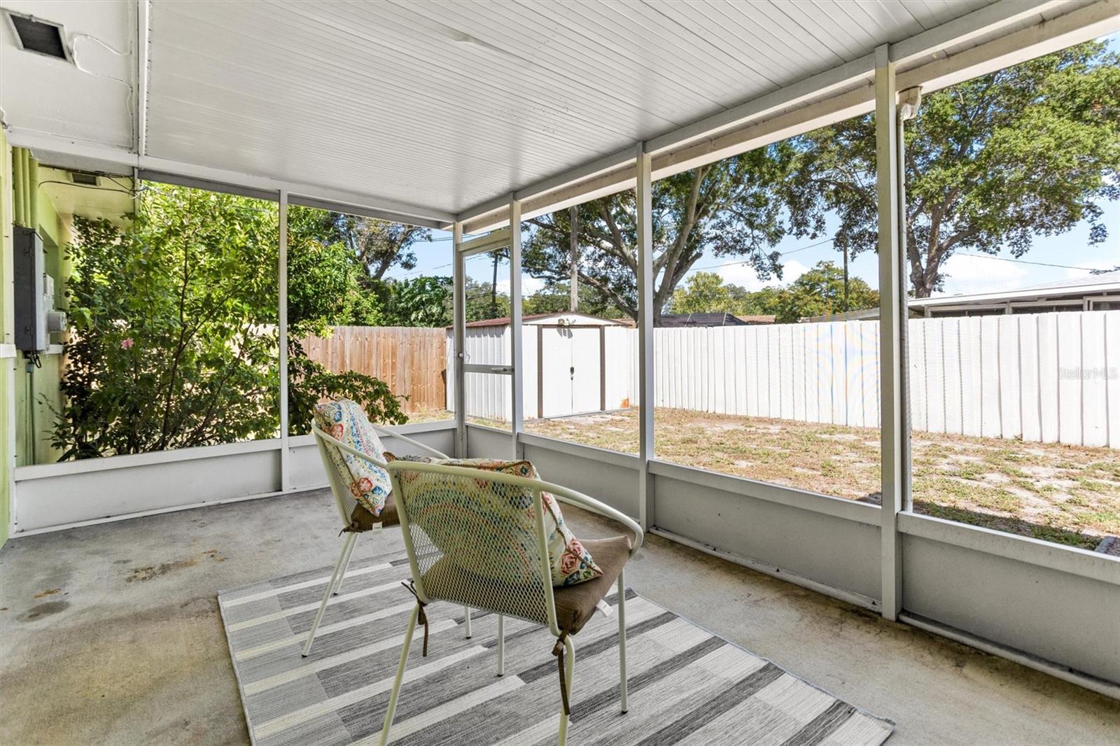 Screened in side porch off kitchen.