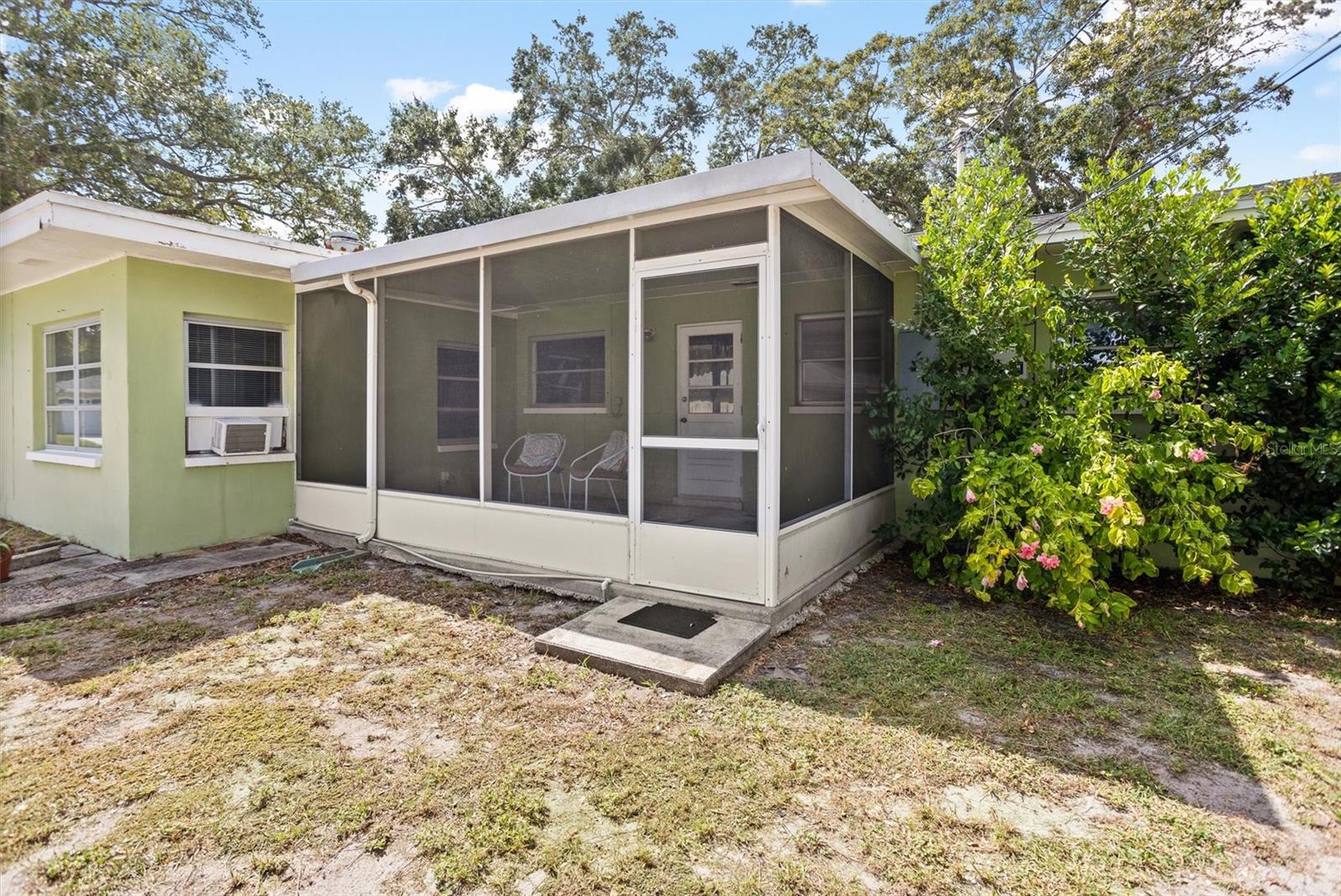 Screened in side porch off kitchen.