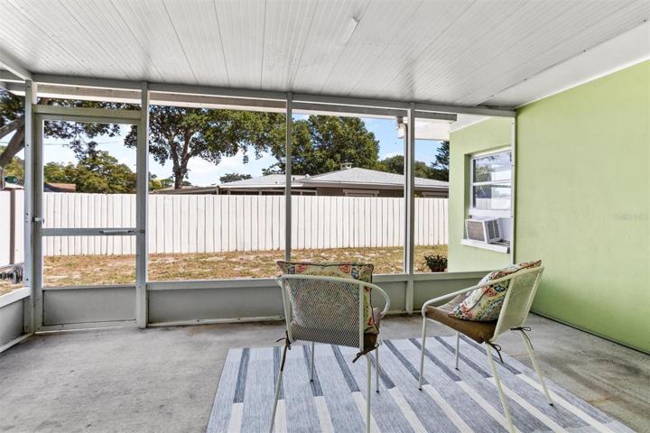 Screened in side porch off kitchen.