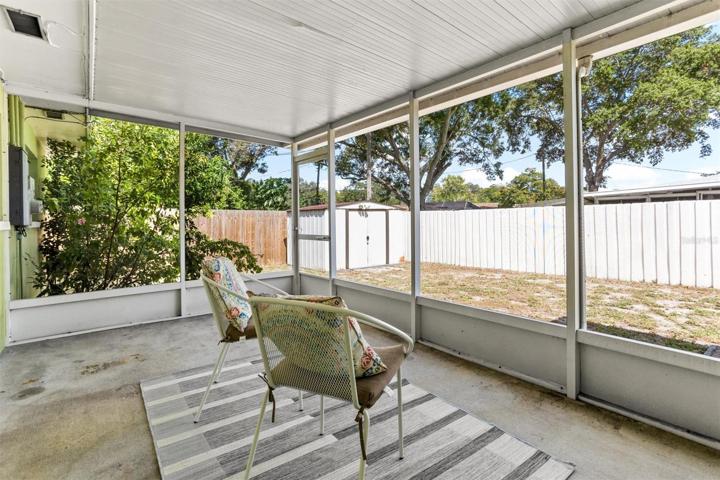 Screened in side porch off kitchen.