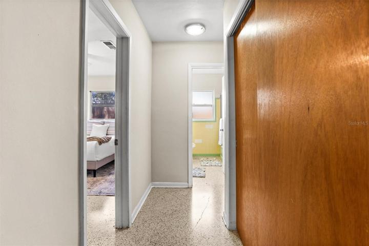 Hallway with ample closet space for storage.