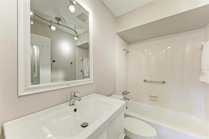 Updated bath with Tub and shower, safety bar