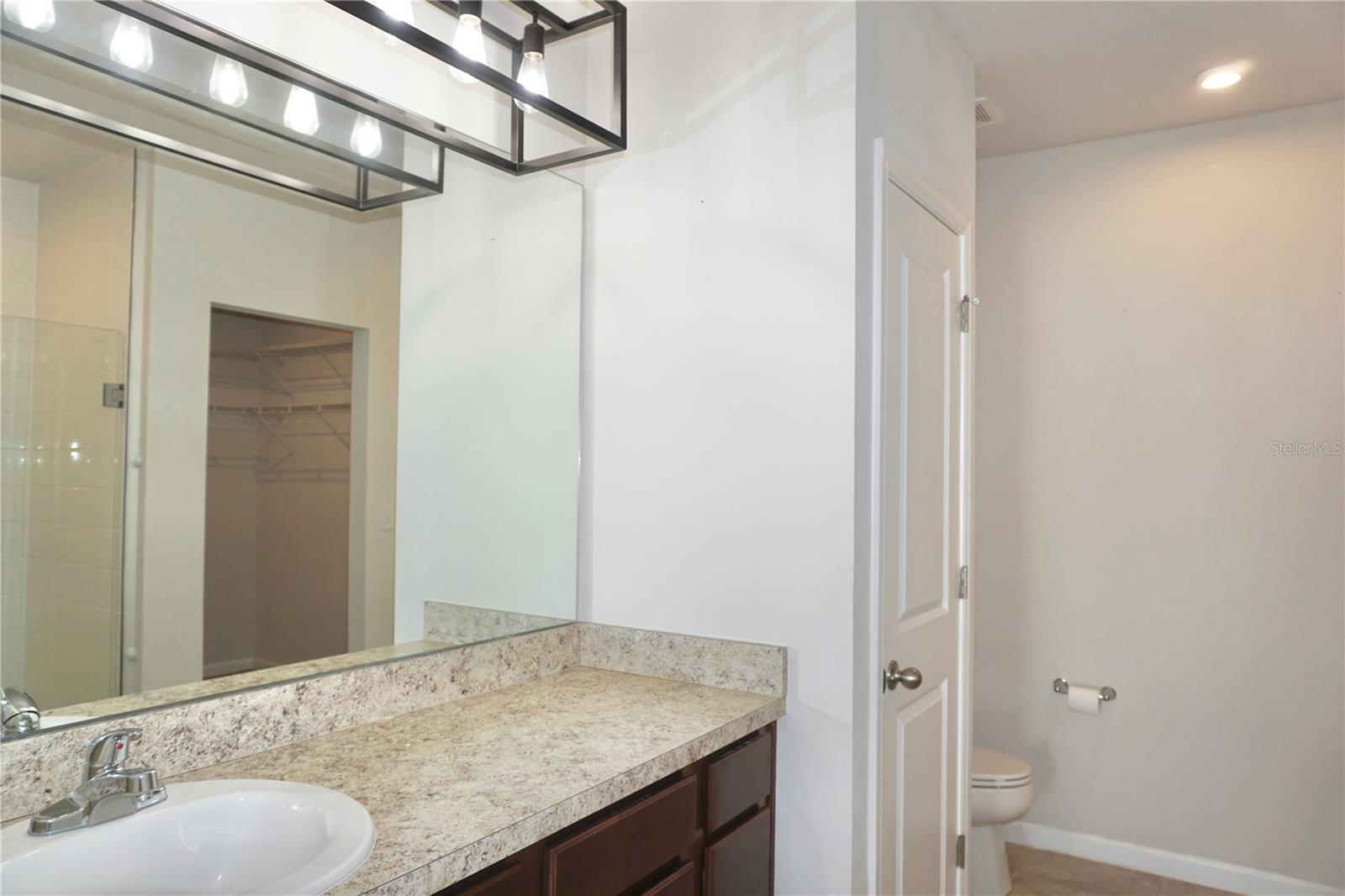 Primary en-suite with high countertops
