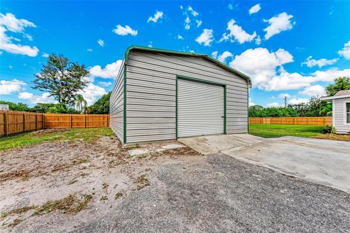 30' x 40' outbuilding, comes equipped with electric, exhaust fan and concrete slab.