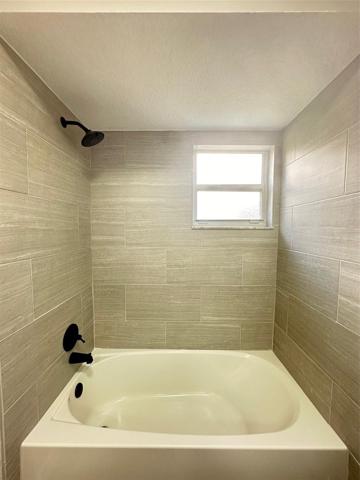 Guests New Full Bathroom with tiled tub surround