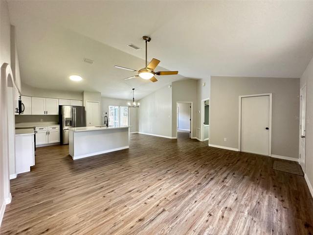 Open Living Room to Kitchen to Dining Room