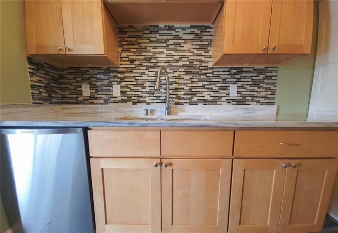 Updated wood cabinetry in kitchen