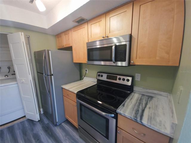 Marble counters, SS Appliances, wood cabinetry
