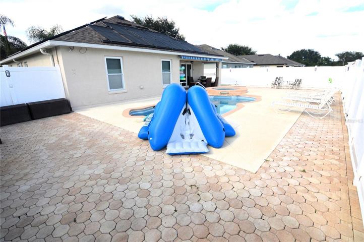 Rear pool deck area with 6' vinyl privacy fence