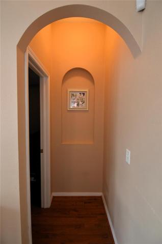 Master bedroom entry with arched opening and deco niche