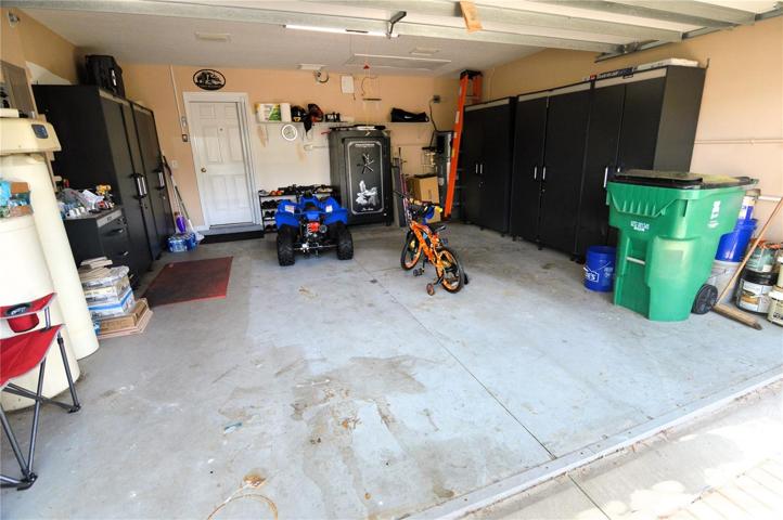Garage with storage cabinets included