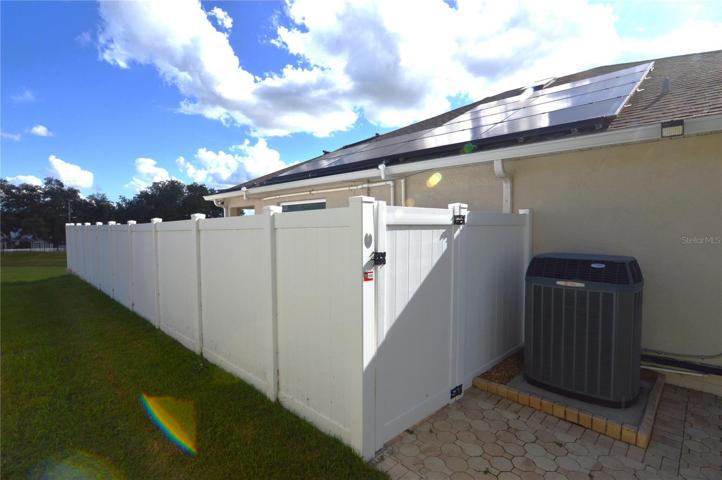 Side view of privacy fence and solar system
