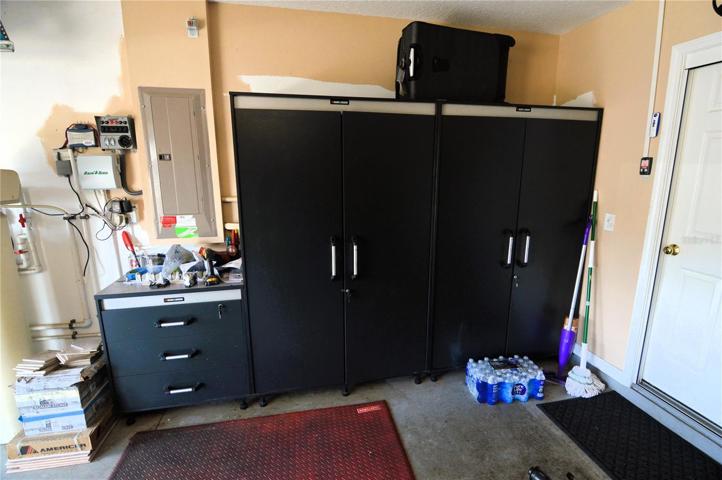 Garage with storage cabinets included