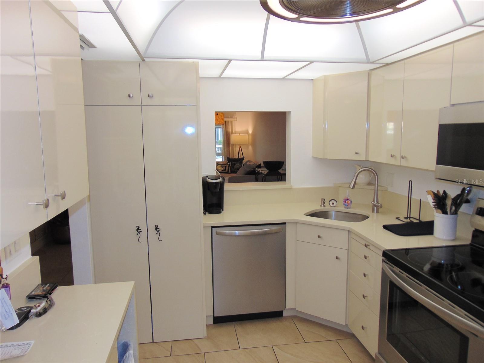 Behind closet doors is the washer &amp; Dryer