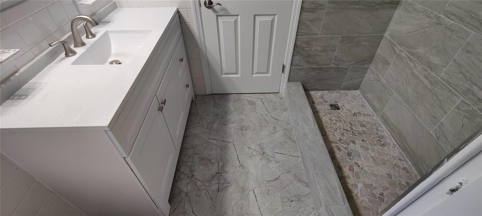 Second floor master bedroom vanity is solid sirface