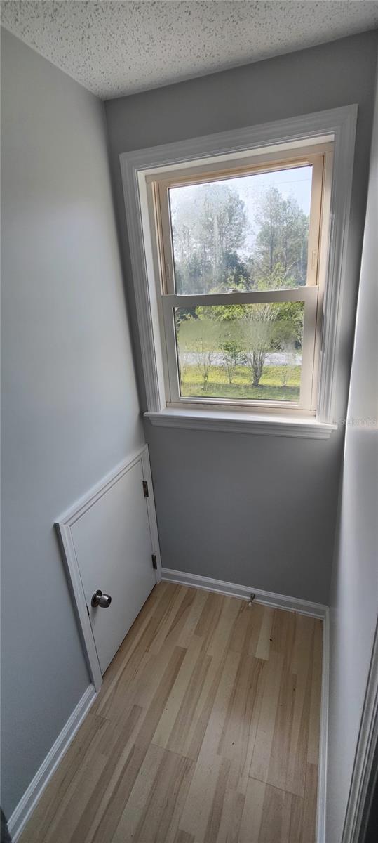 upstairs bonus room window.  Small door on left is used to access the attic storage space.
