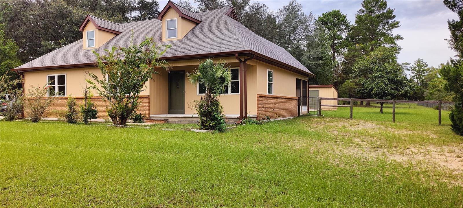 Front and East side of home.  Fenced back yard.  Nearly 1 acre lot and no HOA!  Two story home plus a walk-in basement!