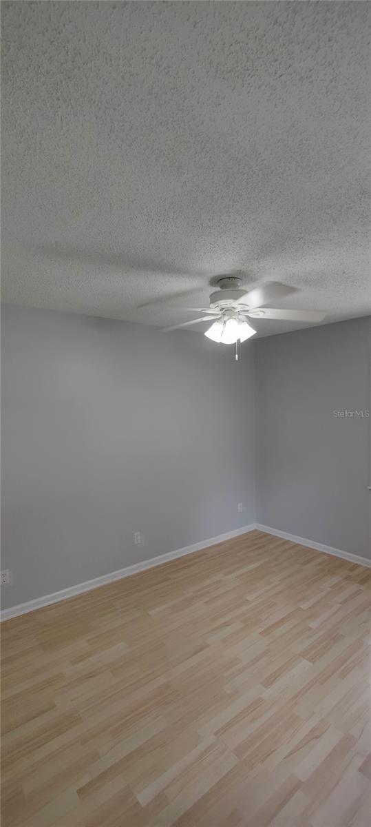 Second bedroom is located on the ground floor and features wood look laminate flooring and an energy saving fan for your comfort.