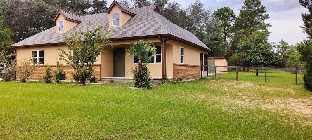 Front and East side of home.  Fenced back yard.  Nearly 1 acre lot and no HOA!  Two story home plus a walk-in basement!