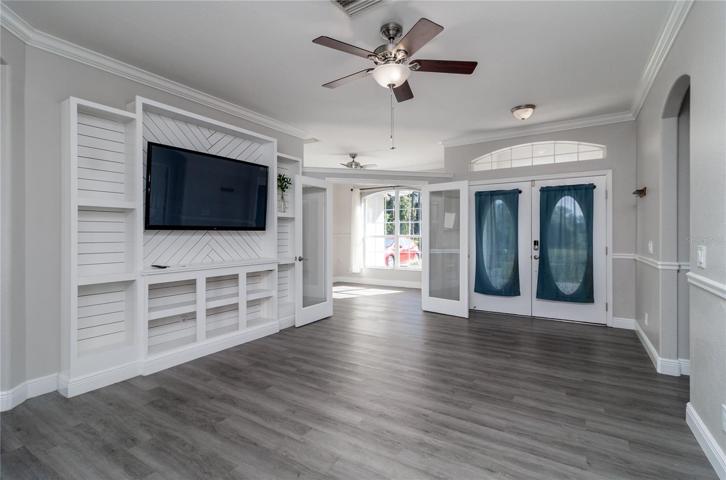 View of the front entrance and office from the living room