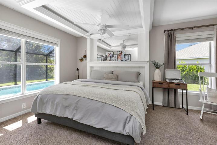 Primary bedroom with pool and privacy views
