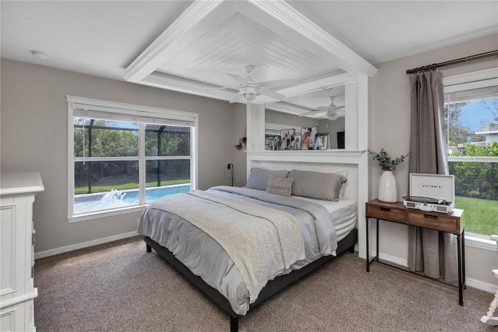 Custom built-in king sized bed accent with dimming lights, outlets, and fan controls