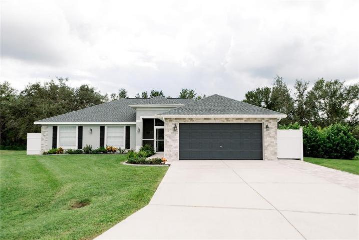 Brand new roof, recently painted exterior, modern brick accents, and decorative window shutters offer charming and inviting curb appeal