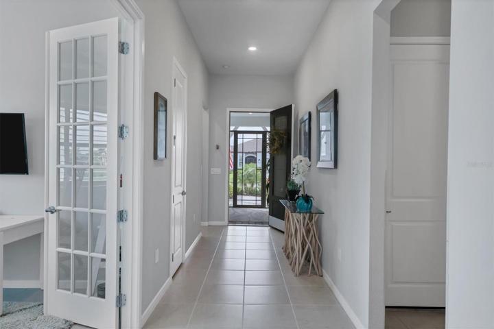 Beginning with the screened entry, the foyer provides a warm welcome