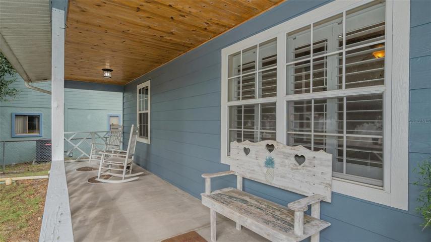 50 x 6 foot covered front porch with wooden ceiling