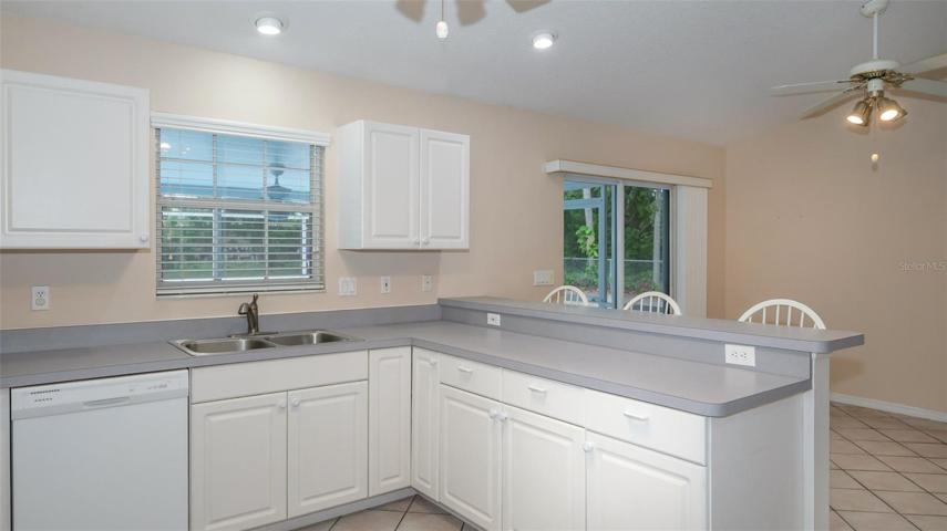Kitchen with breakfast bar and stools