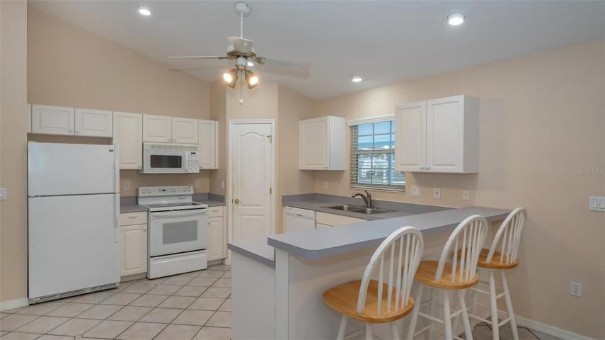 Kitchen with breakfast bar and stools