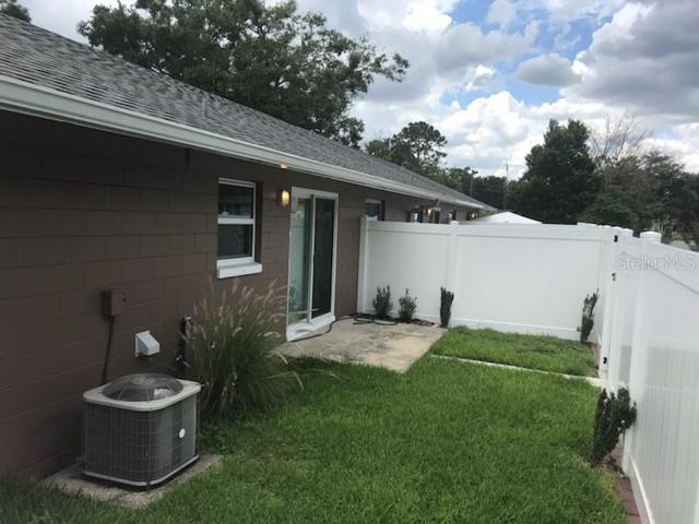 Fenced backyard with lawn maintenance included.