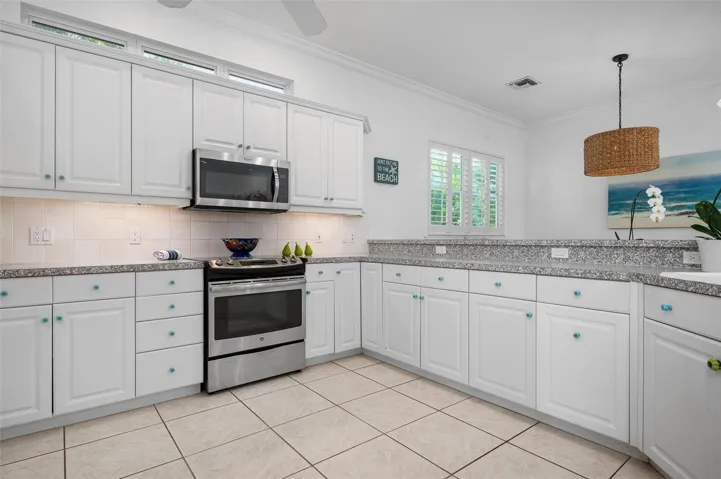 Large kitchen with stainless appliances
