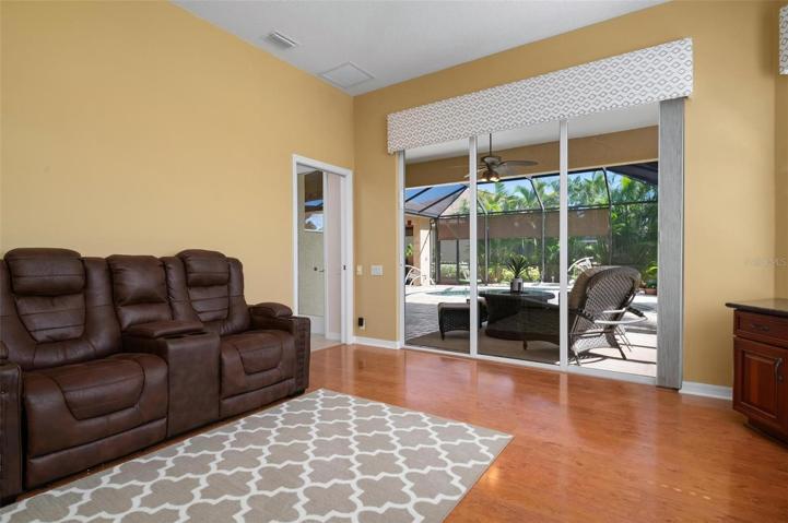 Office/study/den - Sliding doors to lanai, 3rd bath adjacent to room and lanai. (Bedroom 4)